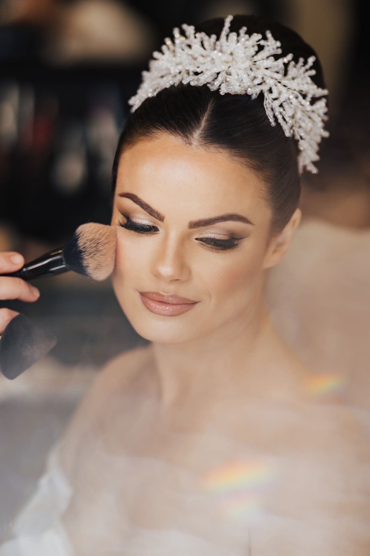Bride with crystal tiara and soft smoky eye bridal makeup