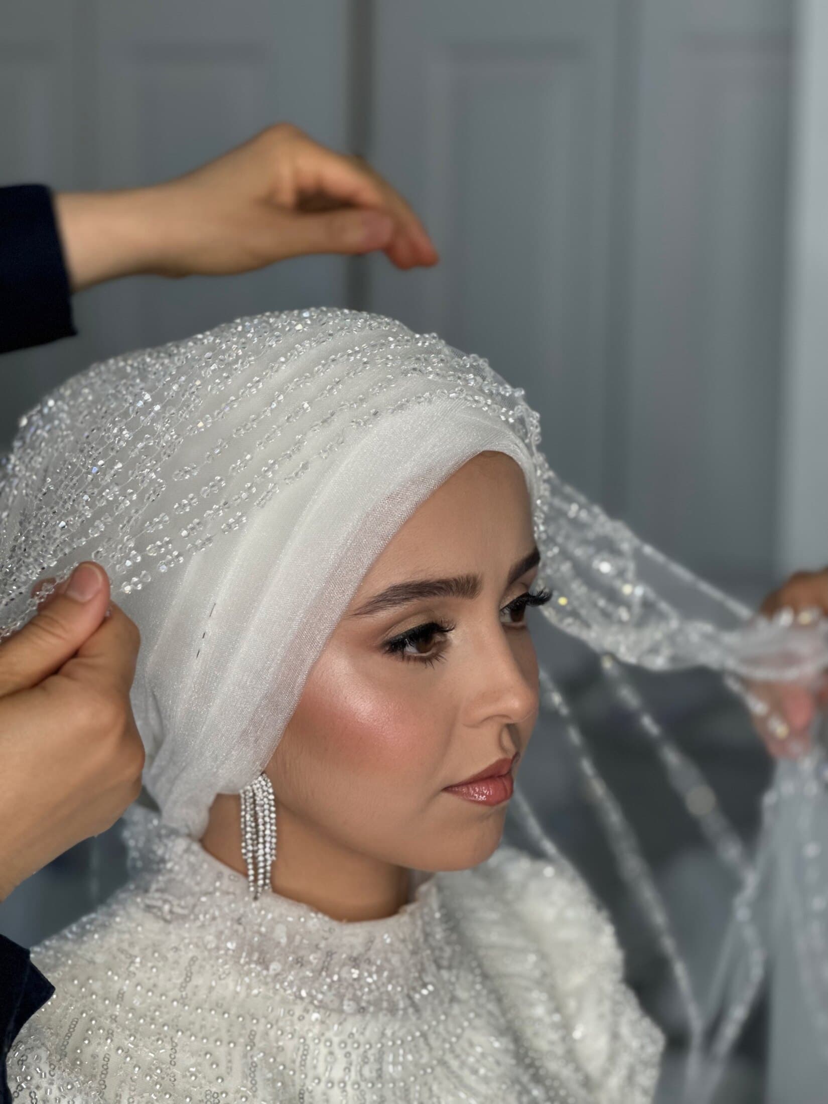 Hijab bride getting ready, elegant bridal makeup