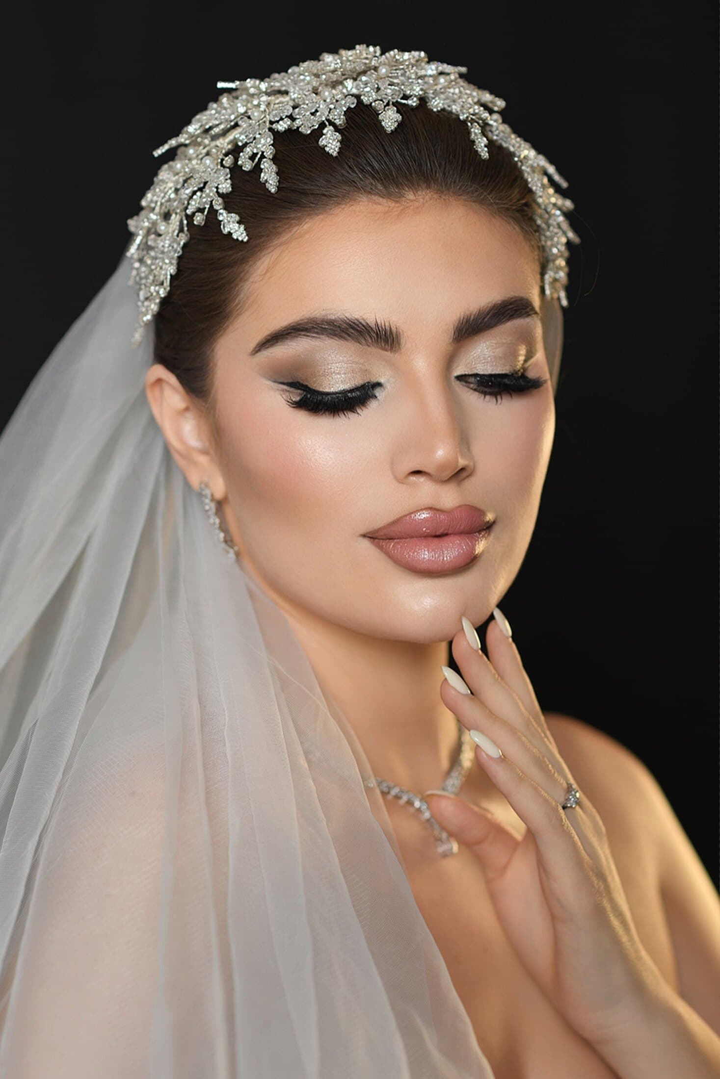 Bride in veil with luminous long-wear bridal makeup