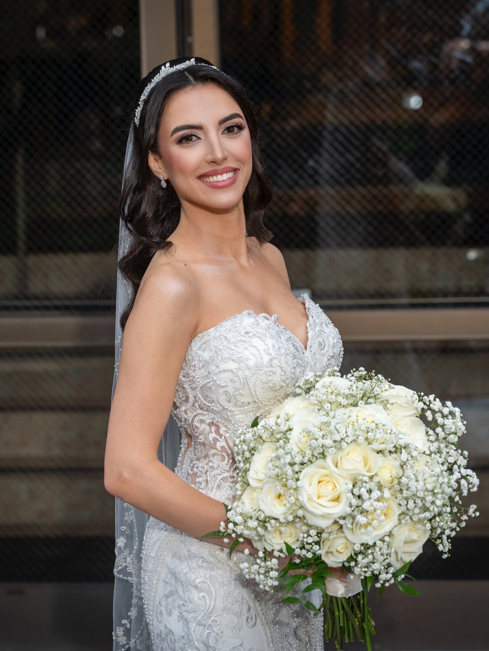 Strapless bride with bouquet, full bridal glam makeup