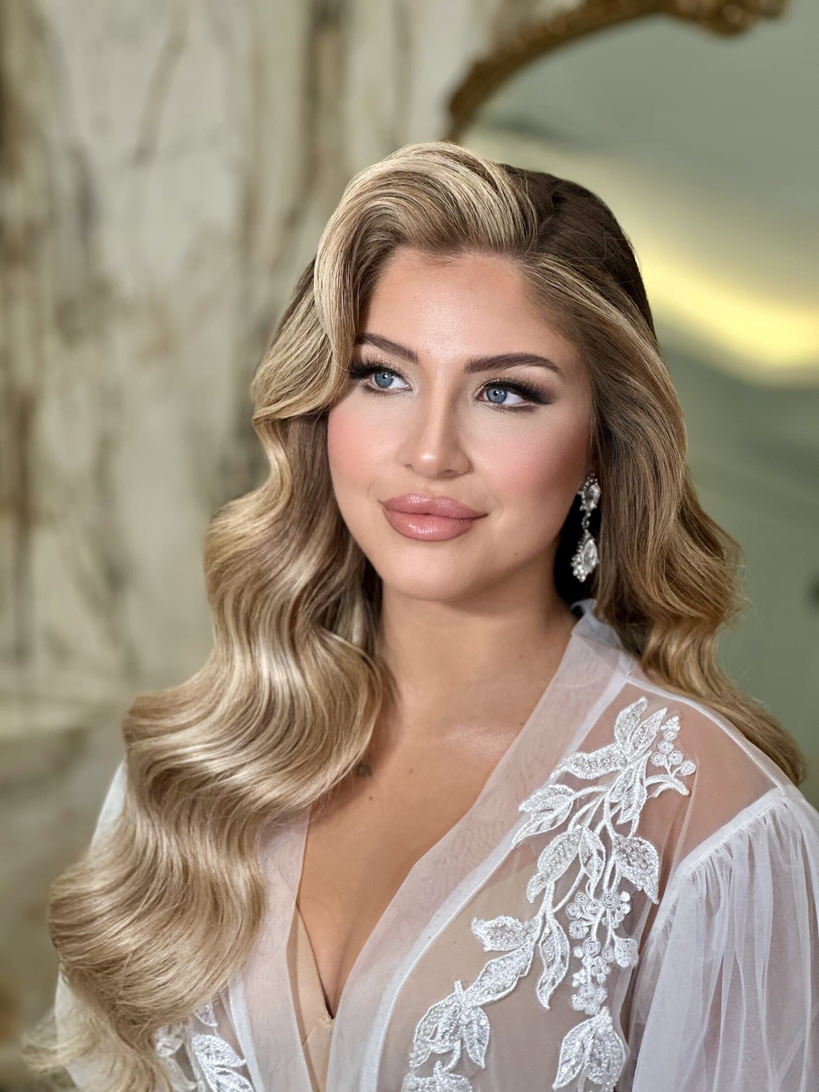 Soft glam beauty look in robe, luminous skin